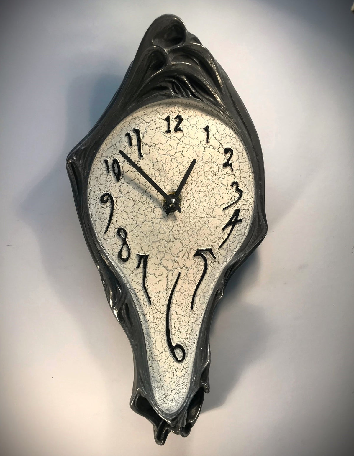 Salvador Dali inspired wall clock with pewter finiosh and white crackle face