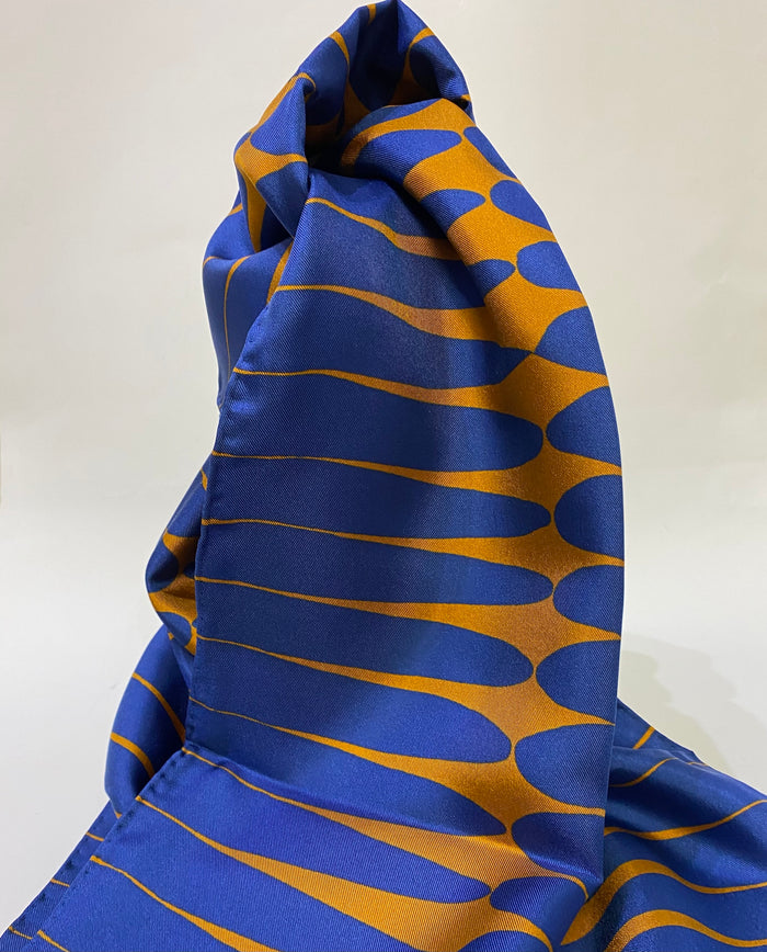 Long ,luxurious 100% silk printed scarf by Faye Stevens.