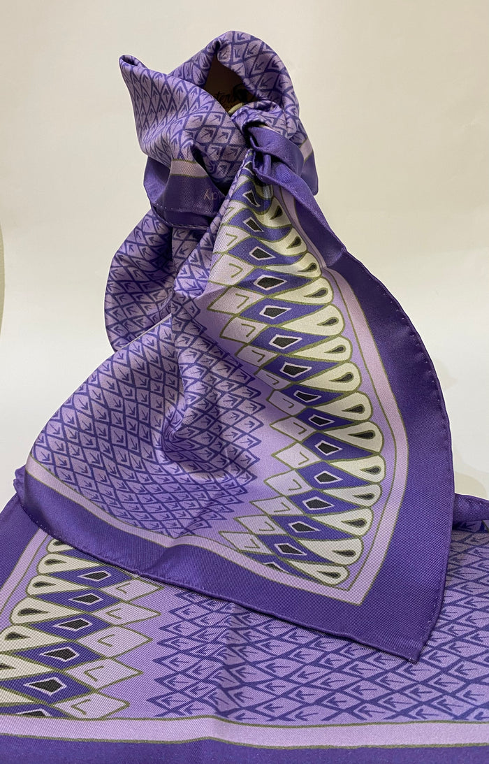 Long, luxurious 100% silk scarf printed with a feather inspired design by Faye Stevens.