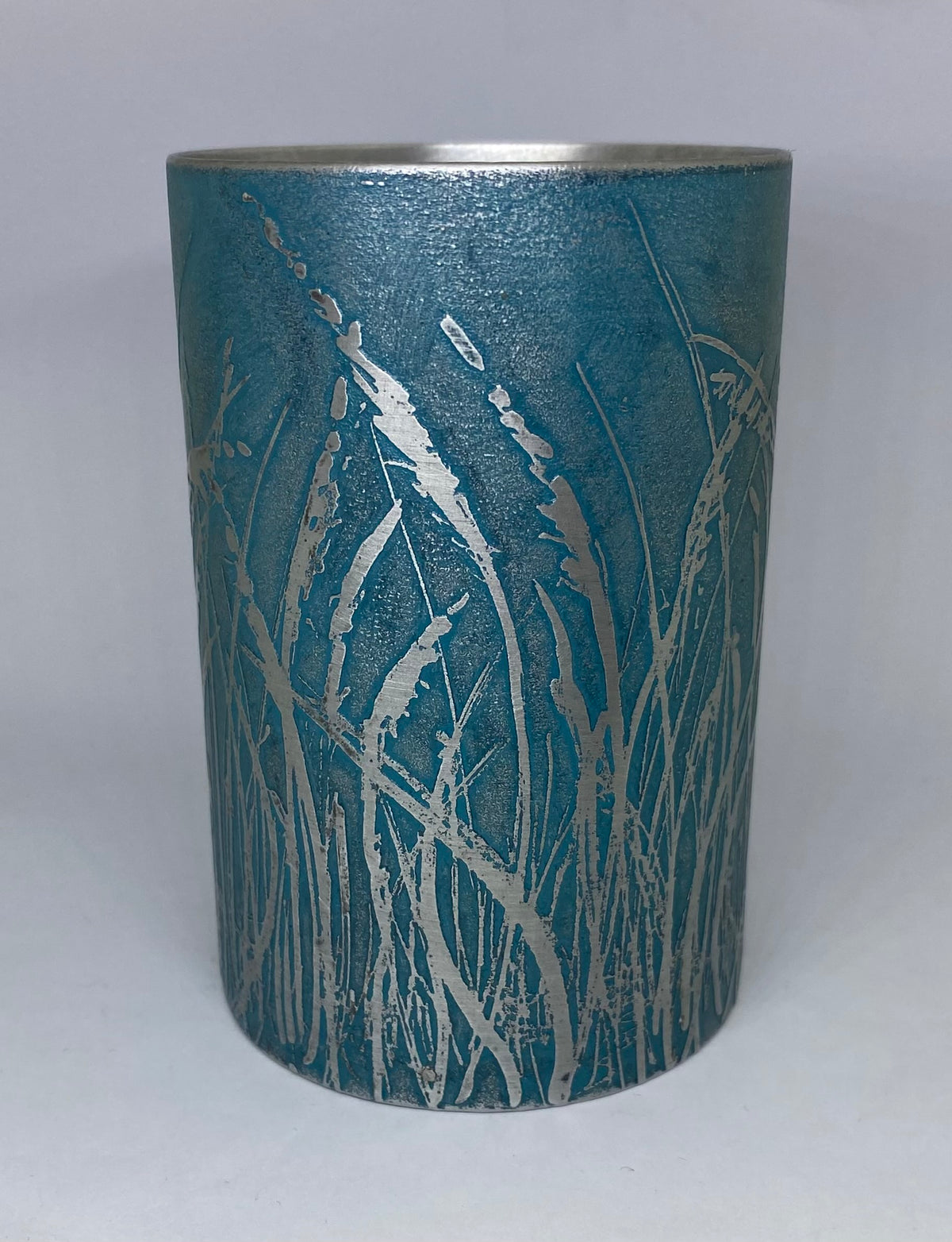 Beautiful teal aluminium vessel - hand etched by Anna Roebuck from her original wild grasses illustration.