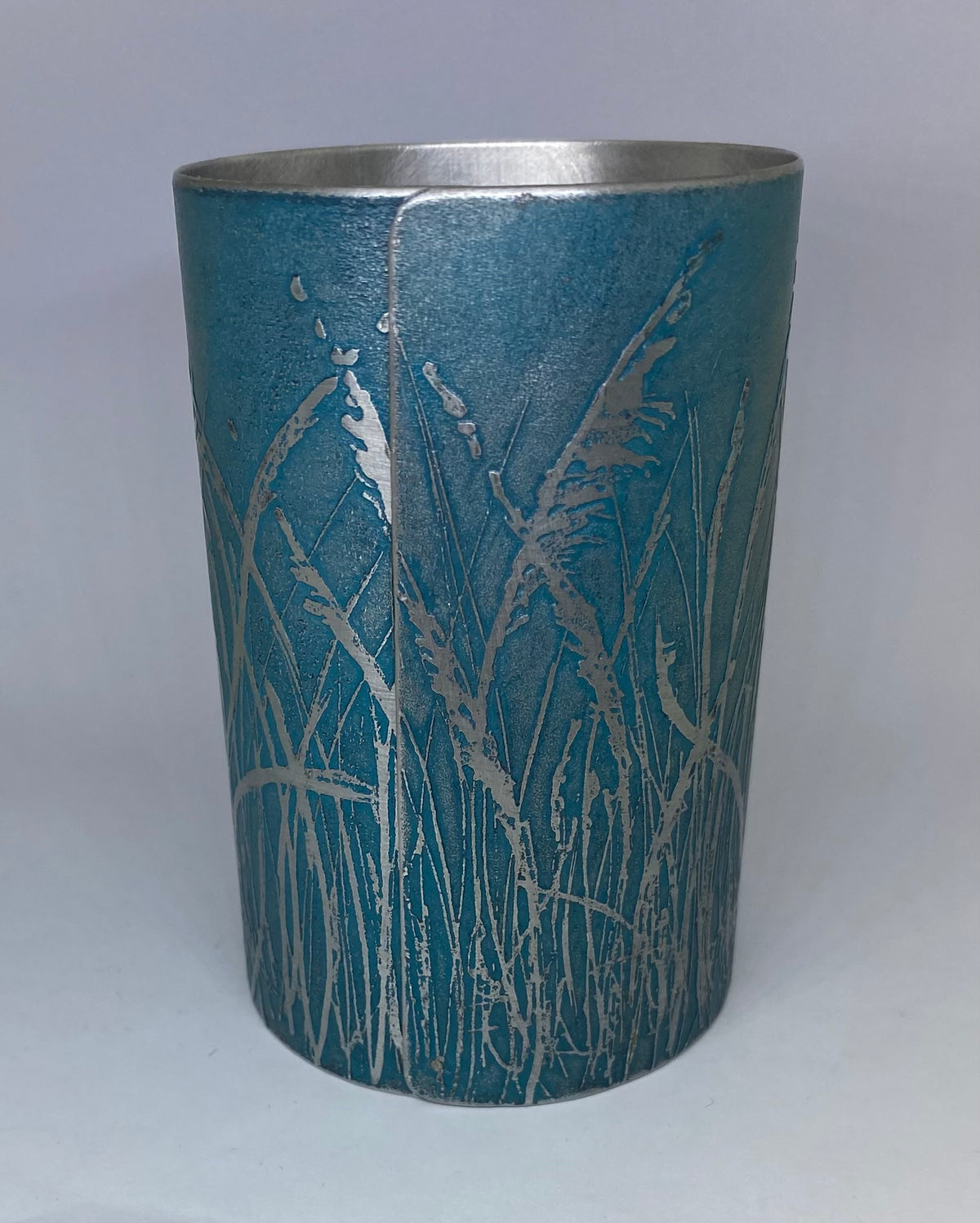 Beautiful teal aluminium vessel - hand etched by Anna Roebuck from her original wild grasses illustration.