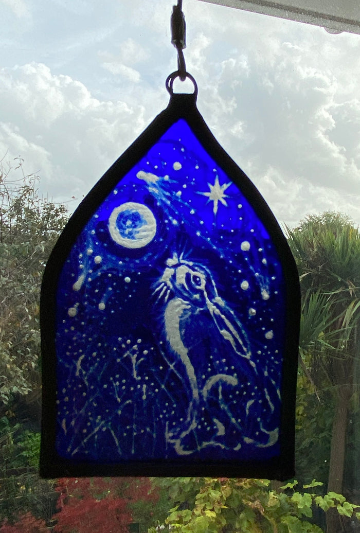 Moongazing Hare in Blue - stained glass panel by Rebecca Jones