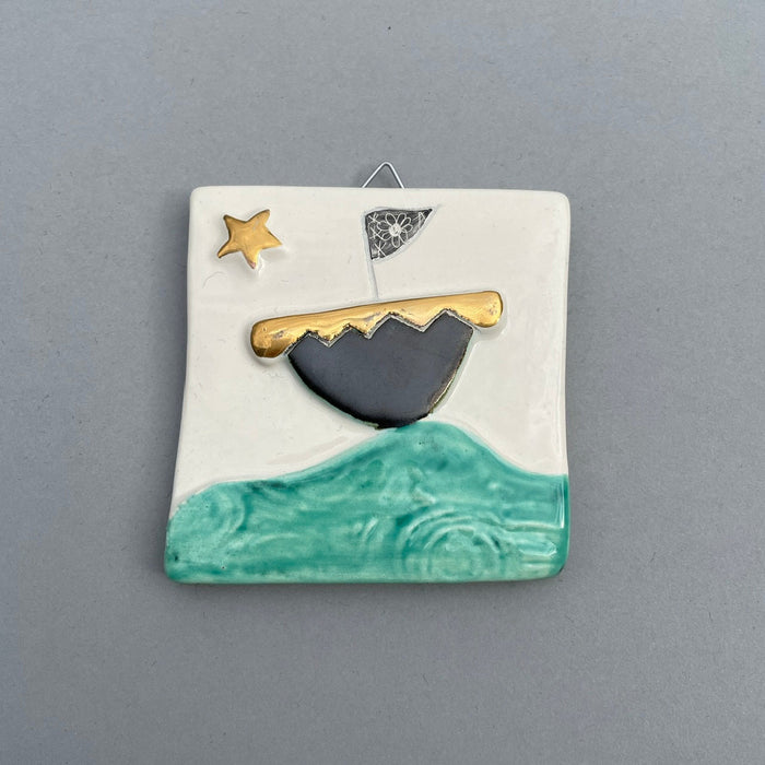 Boat and gold star hanging tile by Sophie Smith