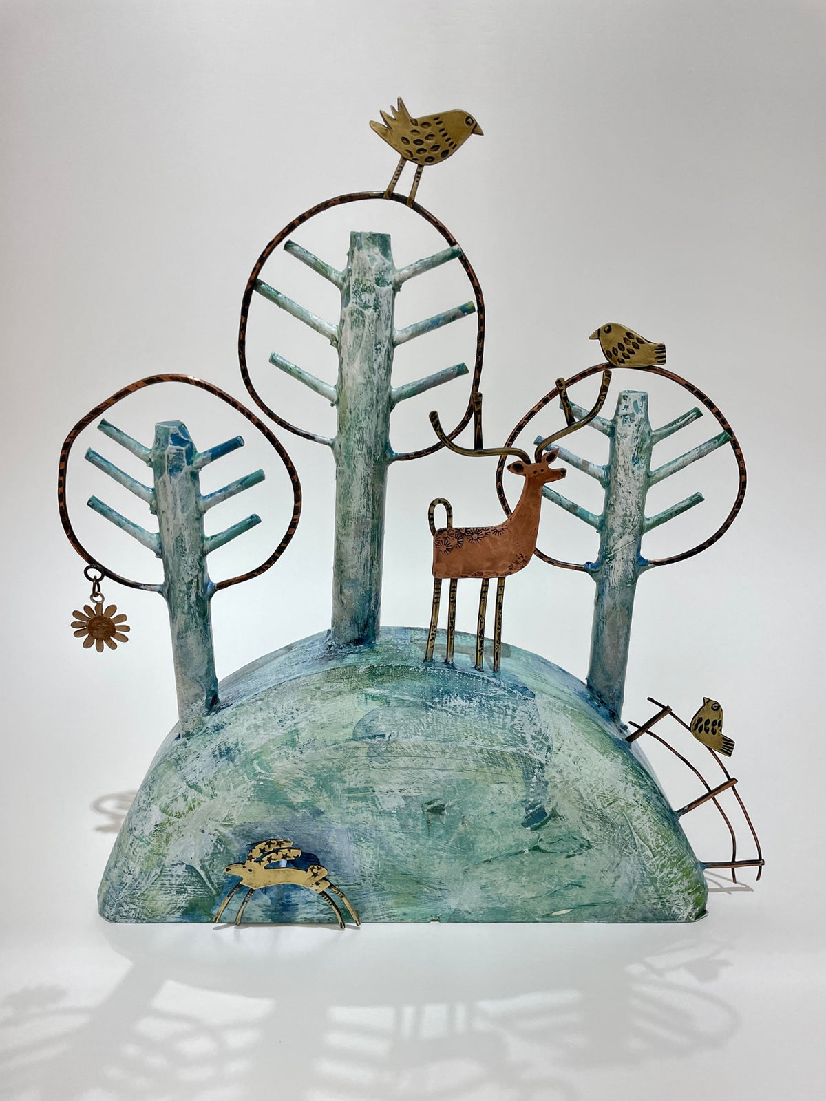 Woodland with three trees, birds, deer and leaping hare by Frances Noon