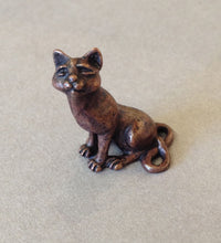 Miniature Sitting Cat by David Meredith