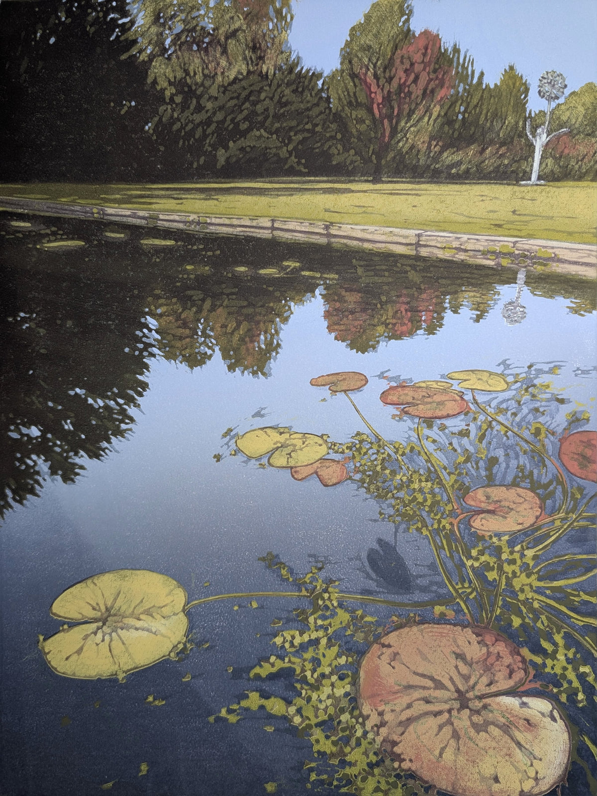 Pond with lily pads and grasses, surrounded by a grassy area and trees.