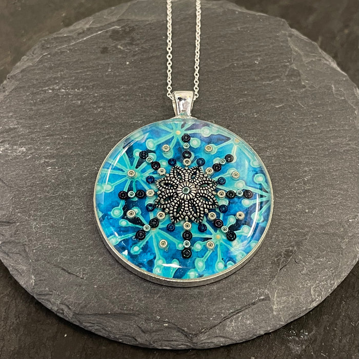 Large blue circular Pendant by NimaNoma