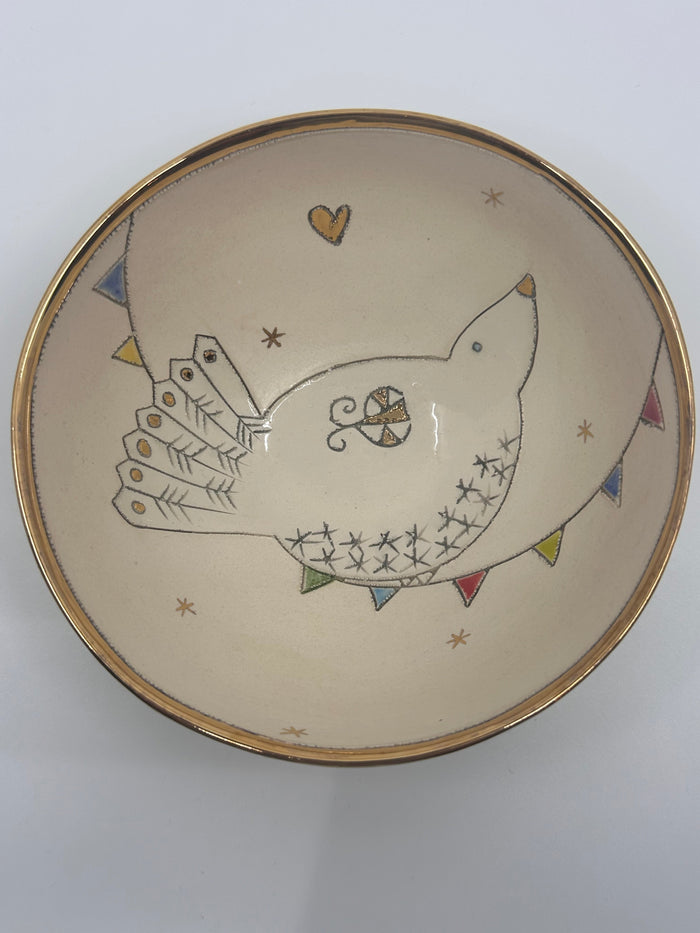 Ceramix bowl with a bird and bunting design
