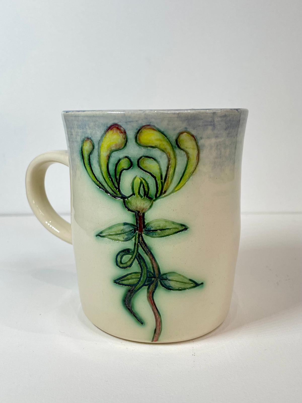 Bee and honeysuckle mug by Jeanne Jackson