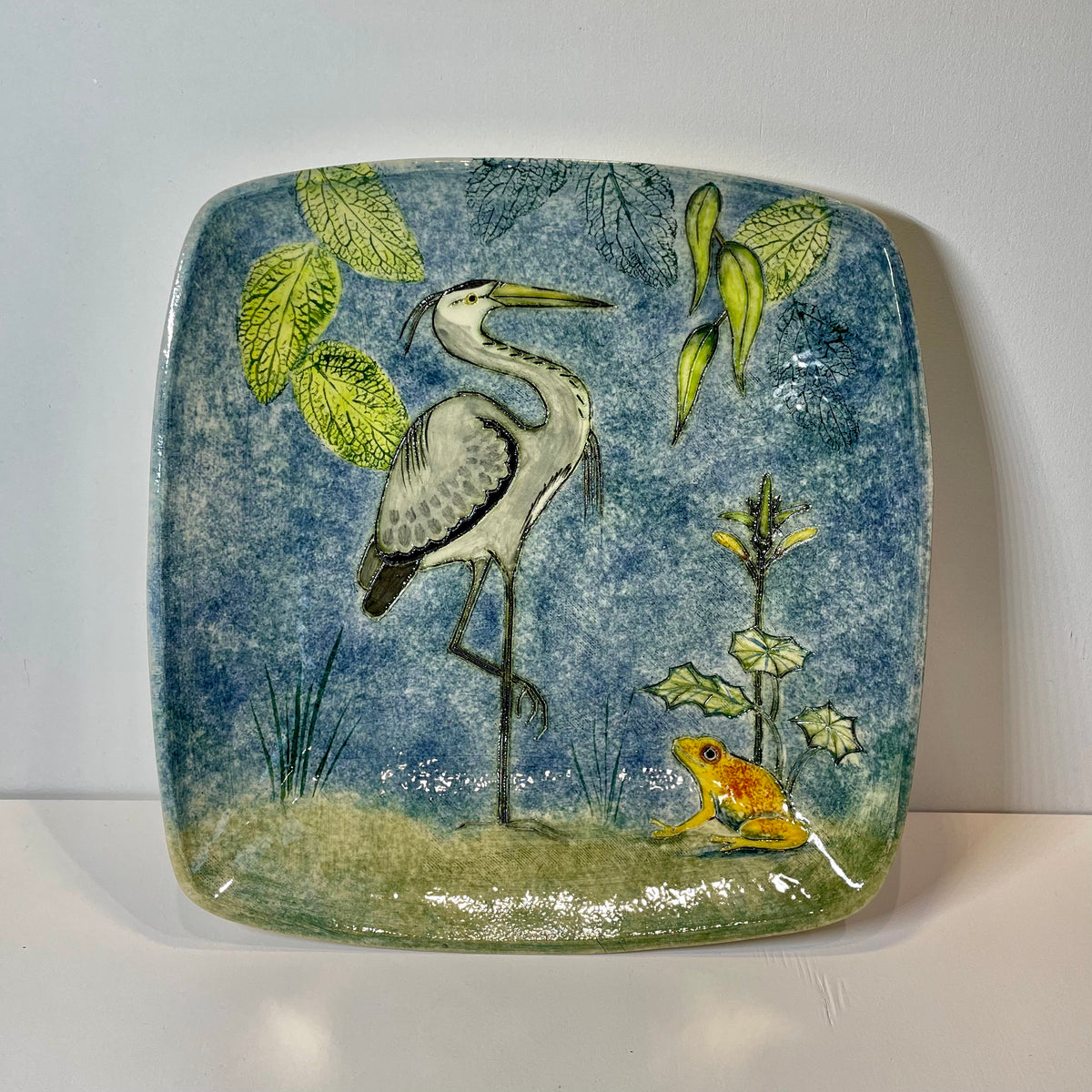 Square heron and frog dish by Jeanne Jackson