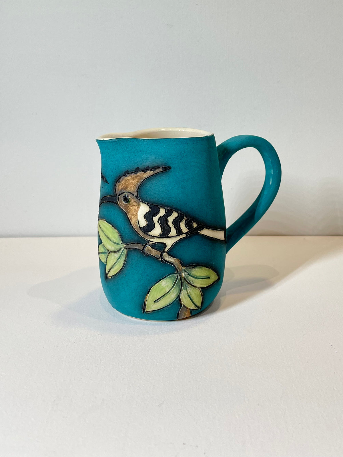 Hoopoe and leaves mini teal Jug by Jeanne Jackson