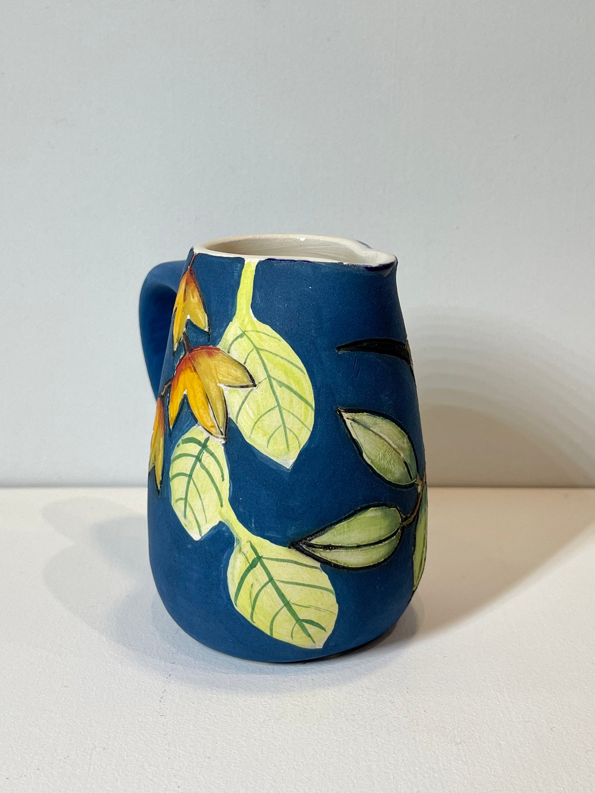 Hoopoe and leaves mini blue Jug by Jeanne Jackson