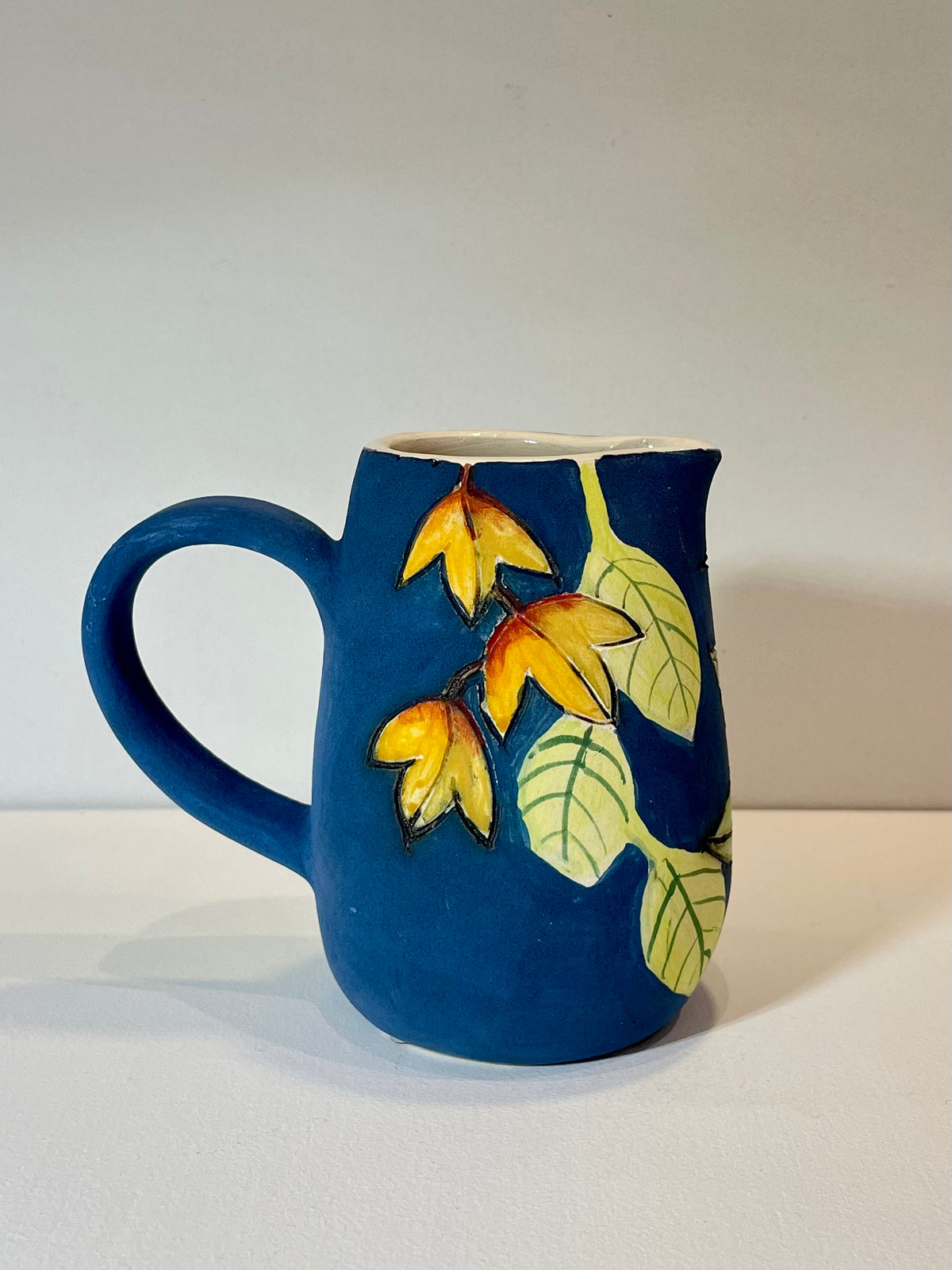 Hoopoe and leaves mini blue Jug by Jeanne Jackson