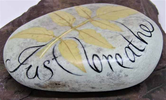 Hand painted stone by Alexis Penn-Carver