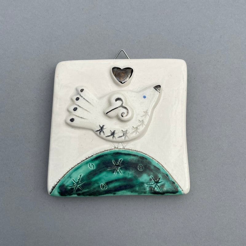 Bird on mound with platinum heart hanging tile by Sophie Smith