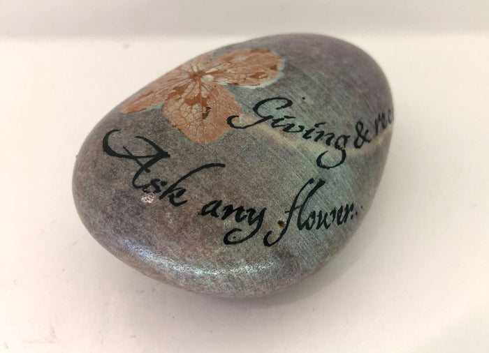 "Giving and receiving is all one. Ask any flower." Handpainted stone by Alexis Penn Carver