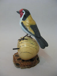 Goldfinch on Apple Bronze by David Meredith