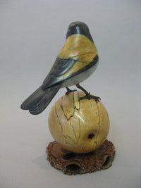 Goldfinch on Apple Bronze by David Meredith
