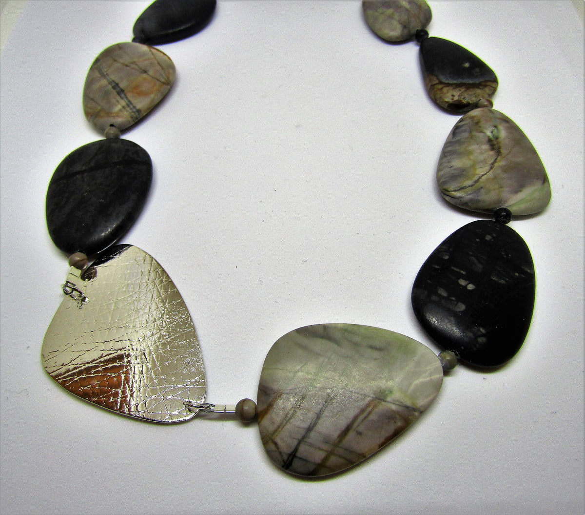 Stunning triangle necklace with picasso jasper. Hand-crafted by studio jeweller Angela Learoyd.