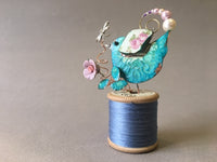 Small Bird on Blue Cotton Reel by Linda Lovatt