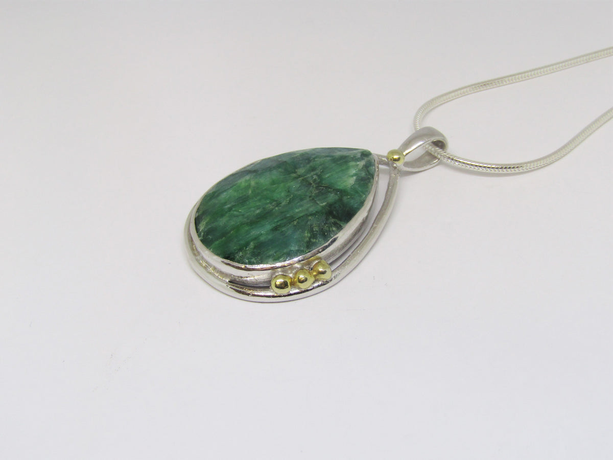 Large 'Poppy' Pendant with Emerald and gold details by Madeleine Blaine.