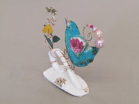 Small Birdie on Cup Handle with Yellow Flower by Linda Lovatt