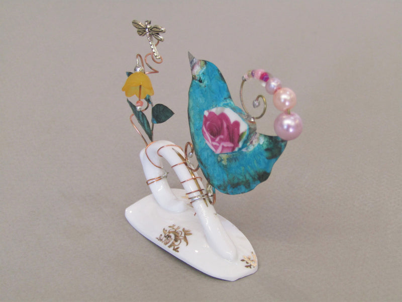 Small Birdie on Cup Handle with Yellow Flower by Linda Lovatt